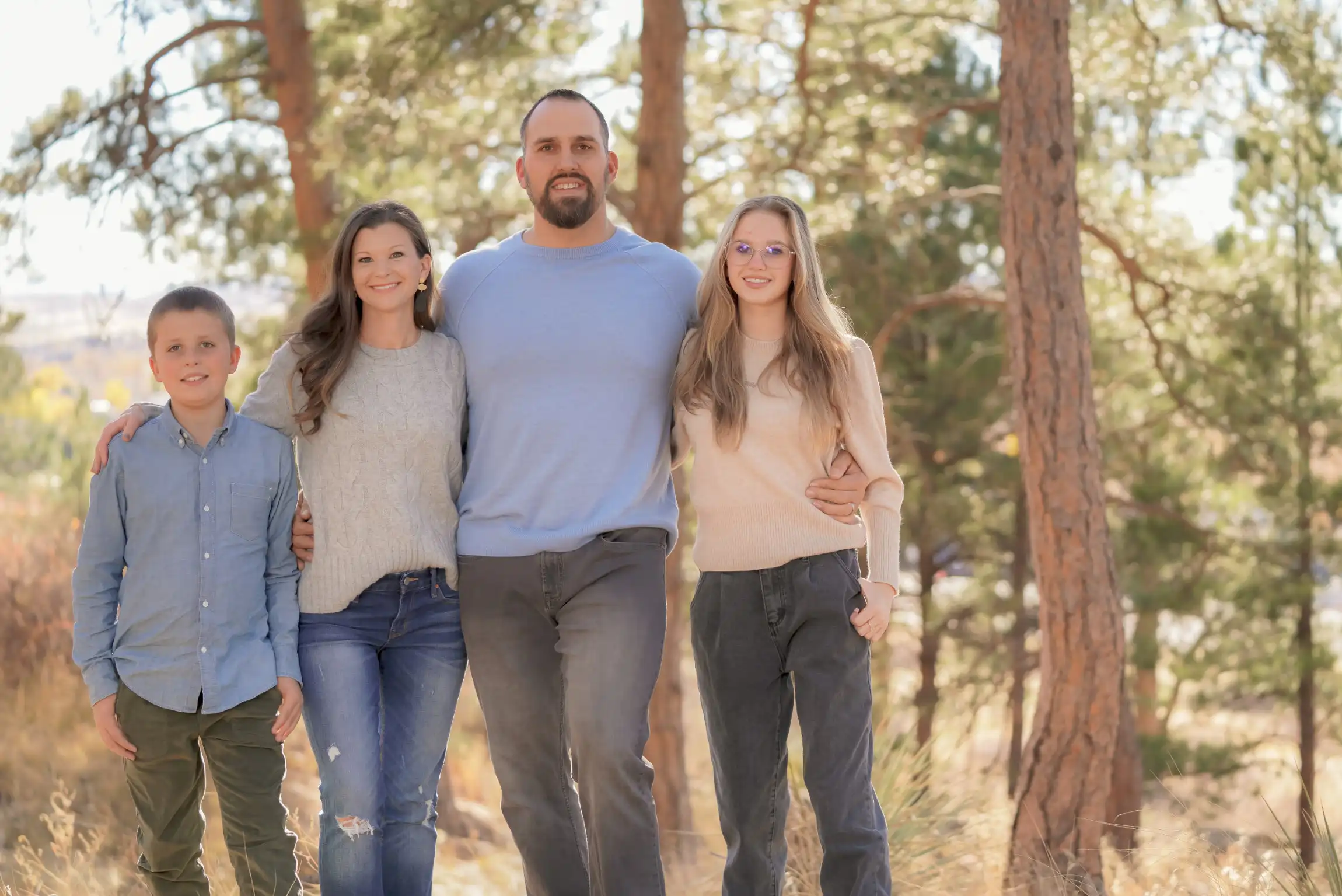 Chiropractor with family outdoors