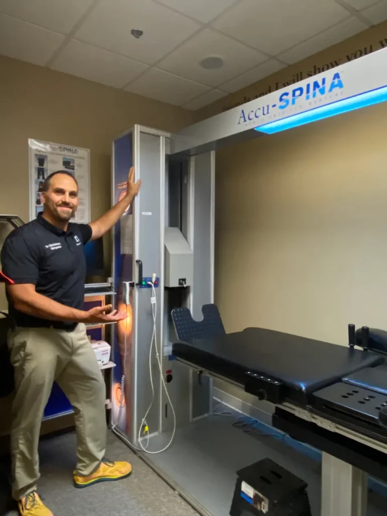 Doctor using spinal decompression machine to support back pain relief and recovery